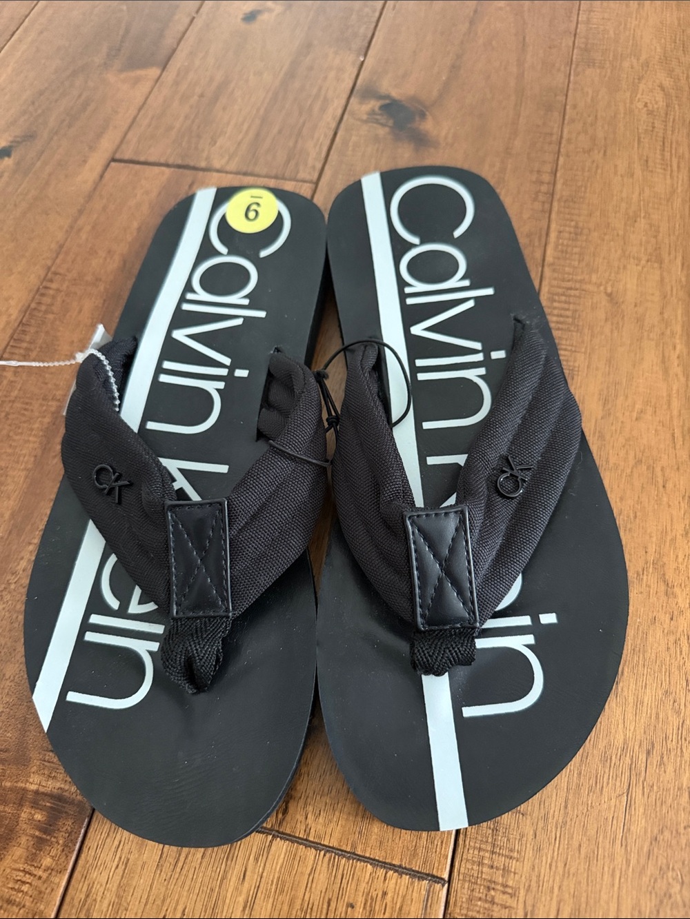 Calvin Klein Black Flip Flops with White Stripe